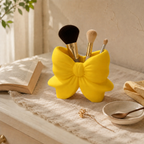 Yellow Bow Brush Holder styled on a vanity