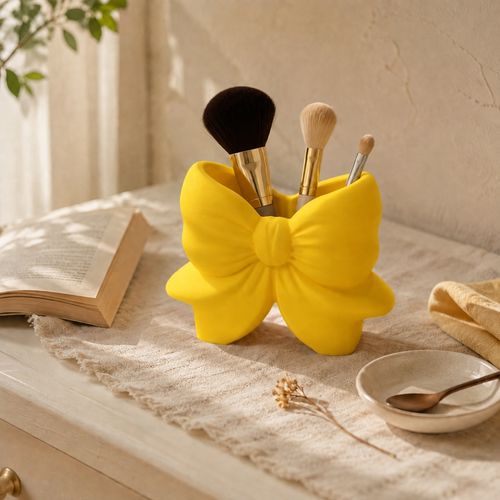 Yellow Bow Brush Holder styled on a vanity